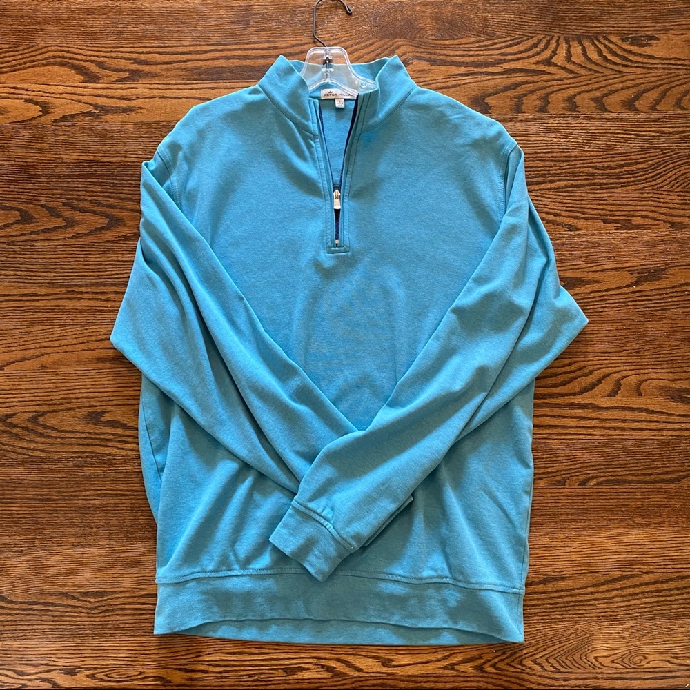 Men’s teal Peter Millar quarter-zip.